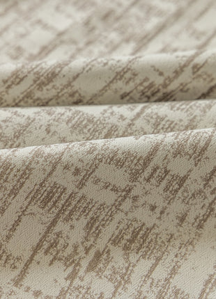 a close up of a white and brown fabric
