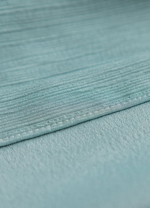 a close up of a light blue fabric