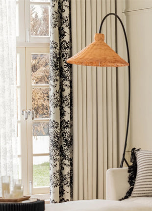 a living room with a couch and a lamp