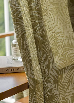 a book on a table next to a window