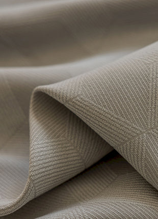 a close up of a beige fabric with a diamond pattern