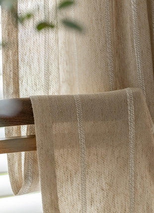 a close up of a window with a curtain