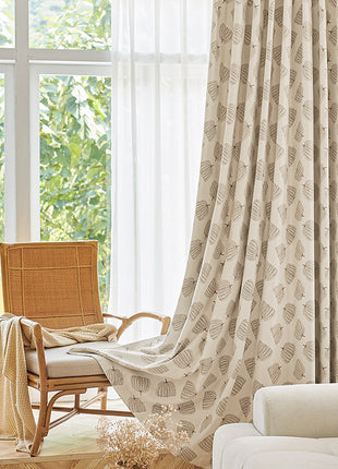 a living room with a chair and a window