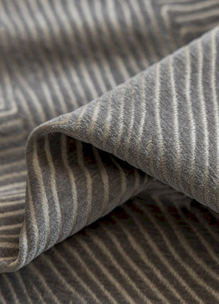 a close up of a gray and white striped fabric