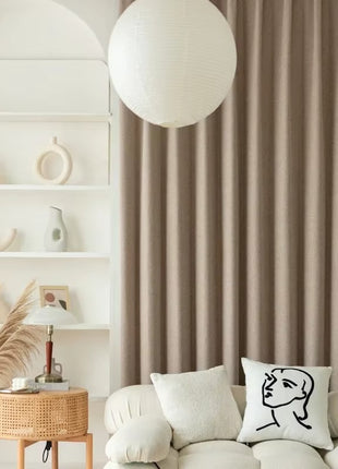 a living room filled with furniture and a large window