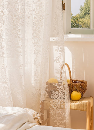 a bedroom with a white bed and a window