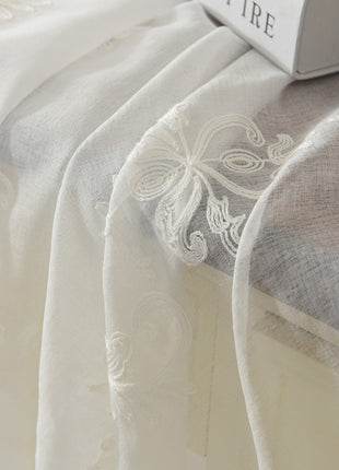 a laptop computer sitting on top of a bed