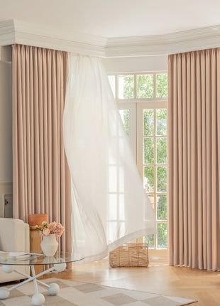 a living room filled with furniture and a large window