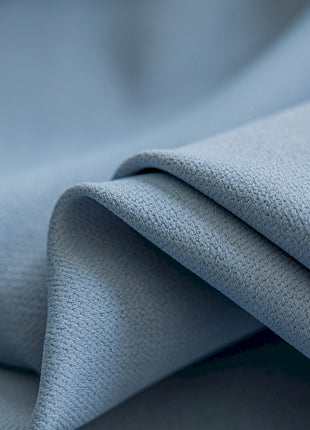 a close up of a light blue fabric
