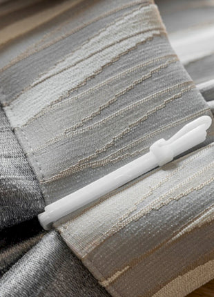 a close up of a chair with a remote control on it