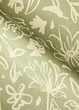 a close up of a green and white fabric