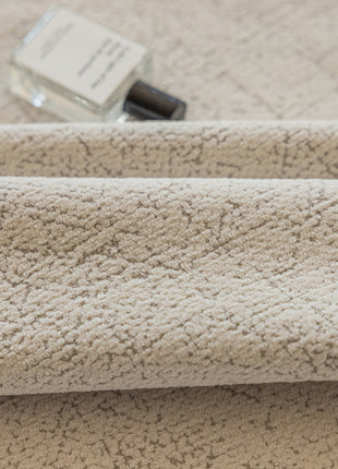 a close up of a towel on a bed