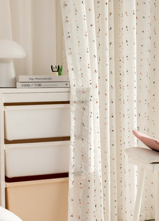 a pink pillow sitting on top of a white table