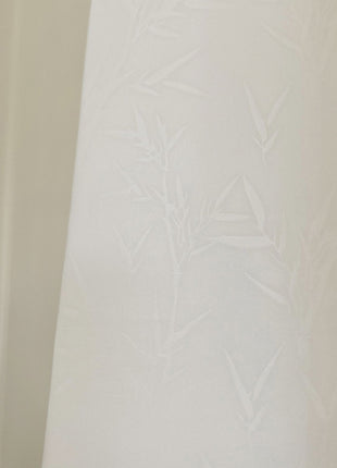 a black and white cat sitting on top of a window sill