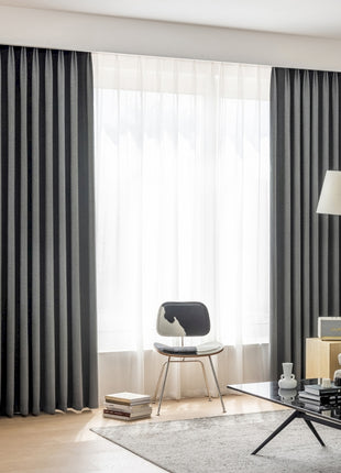 a living room with a couch and a chair