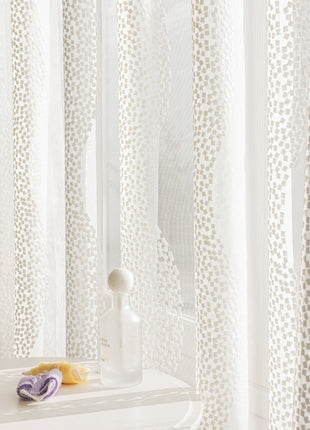 a bathroom with a sink, mirror, and shower curtain