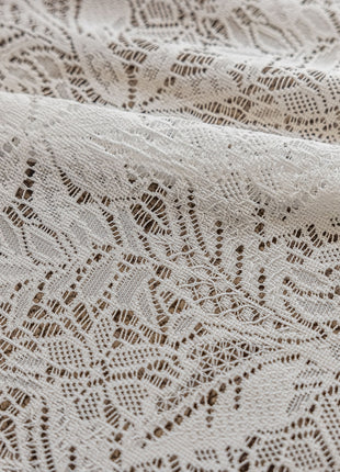 a close up of a white lace fabric