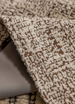 a laptop computer sitting on top of a rug