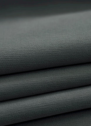 a close up shot of a dark green fabric