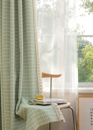 a chair and a table in front of a window