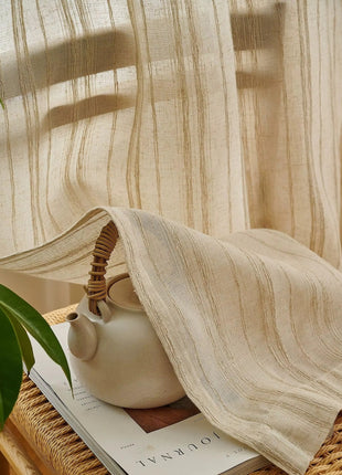 a white tea pot sitting on top of a wooden table