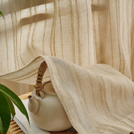 a white tea pot sitting on top of a wooden table