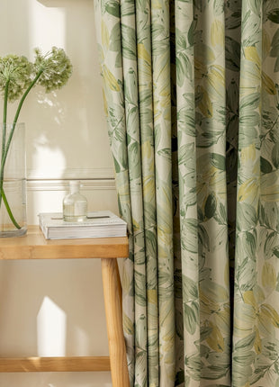 a table with a vase of flowers on top of it