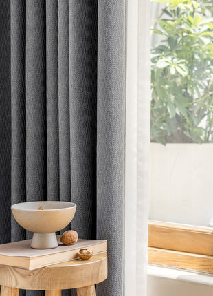a white bowl sitting on top of a wooden table