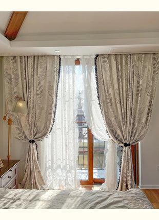 a bed room with a neatly made bed and a window