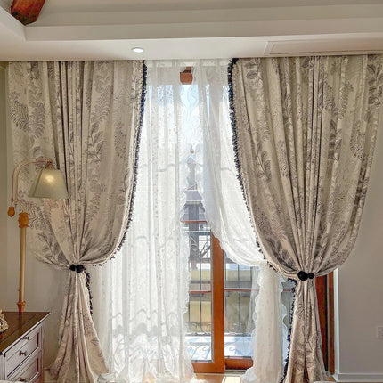 a bed room with a neatly made bed and a window