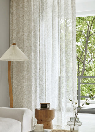 a living room filled with furniture and a lamp