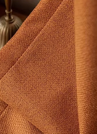 a close up of a curtain on a wooden floor