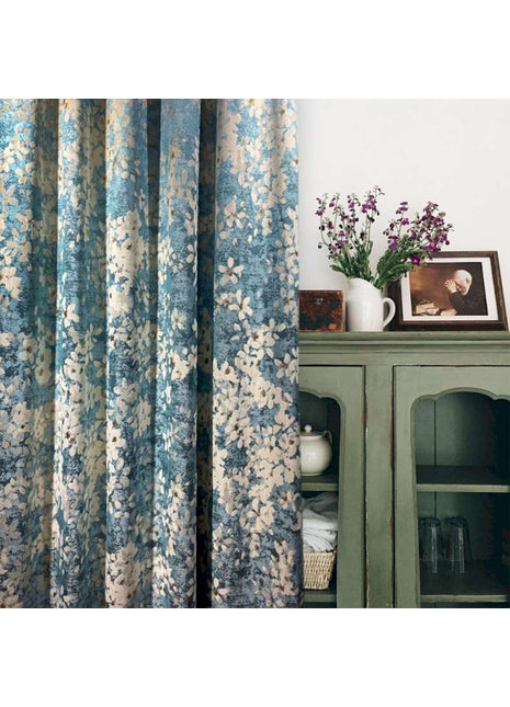 a green cabinet with a vase of flowers on top of it