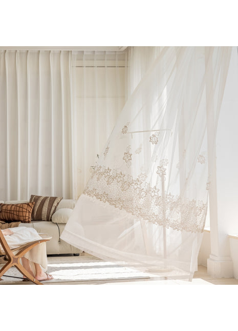a woman sitting on a couch in a living room