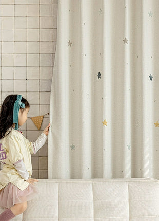 a little girl sitting on top of a white couch