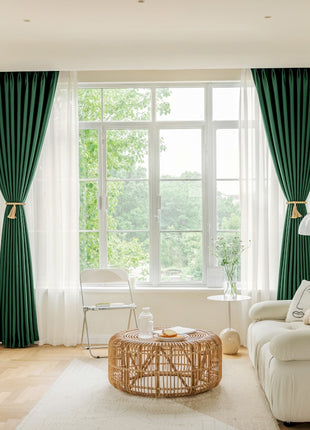 a living room filled with furniture and a large window