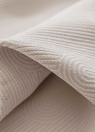 a close up view of a white fabric