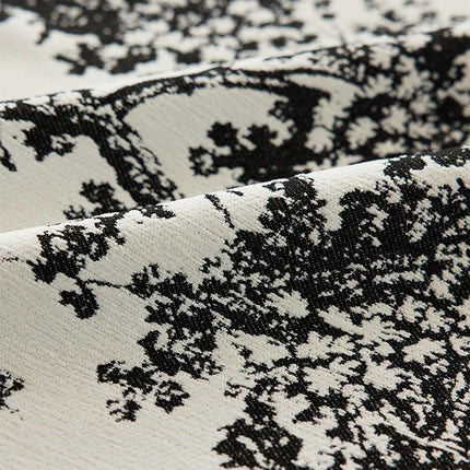 a close up of a black and white fabric