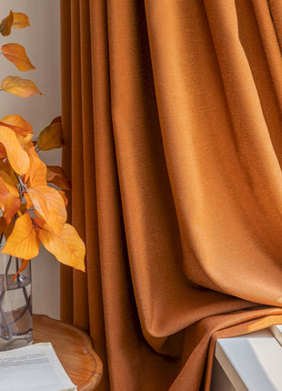 a vase of flowers sitting on a table next to a window