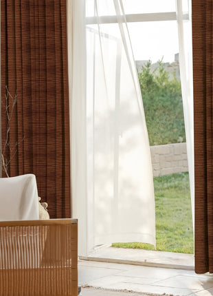 a living room with a couch and a window