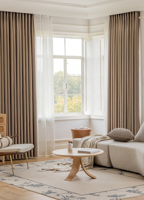 a living room filled with furniture and a large window