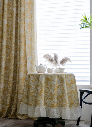 a table with two white vases on top of it
