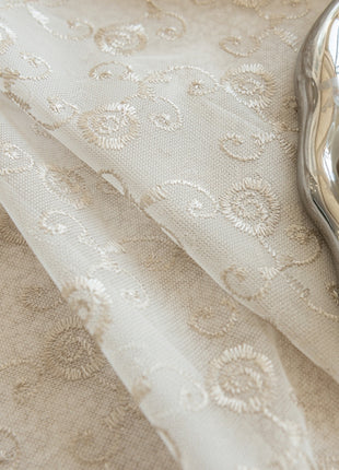 a close up of a cloth with a book on it