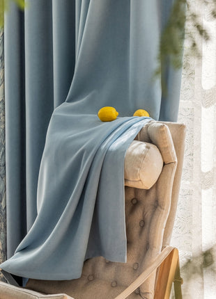 a chair with a blue blanket on top of it