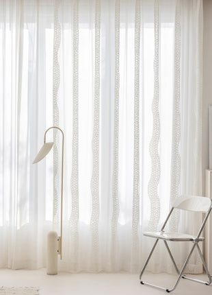 a white room with a chair and a table