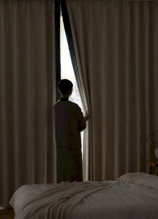 a person standing in front of a window