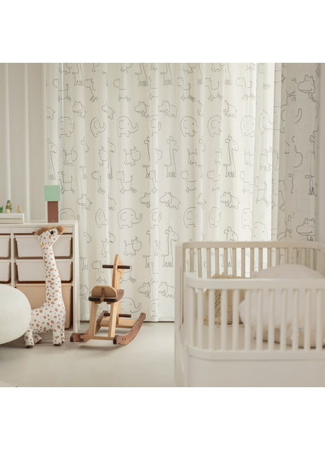 a baby's room with a rocking horse and crib