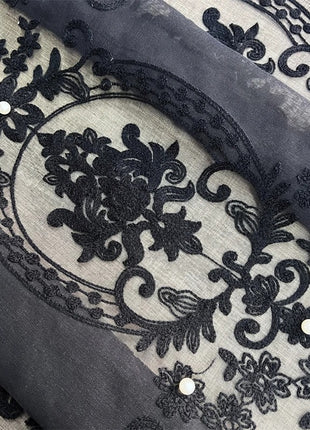 a knife laying on top of a piece of cloth