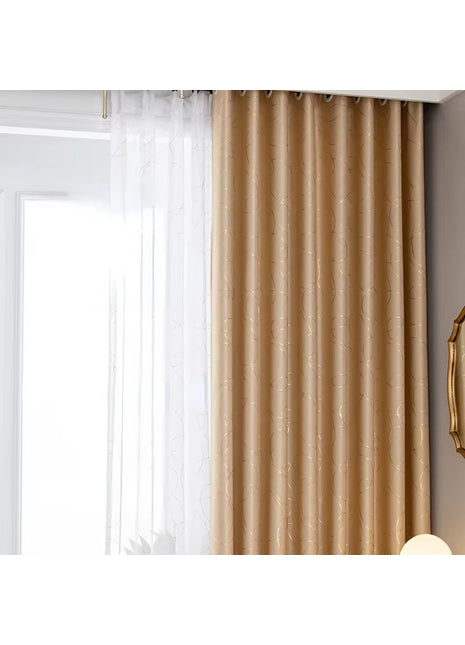 a living room with a large window covered in curtains