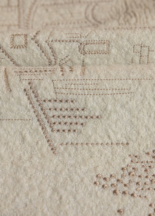 a close up of a piece of fabric with a basket on it